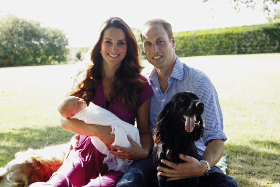 Prince William and Catherine, the Duchess of Cambridge, with Prince George and their beloved dog Lupo