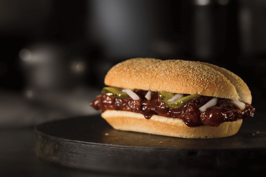 The McRib burger is made up of a pork patty shaped like a miniature rack of ribs and topped with barbecue sauce, onions, and pickles