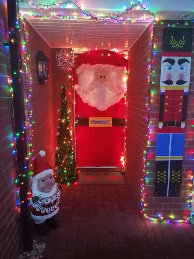 And this mum spent a few quid on a red blanket to turn her front door into Father Christmas 