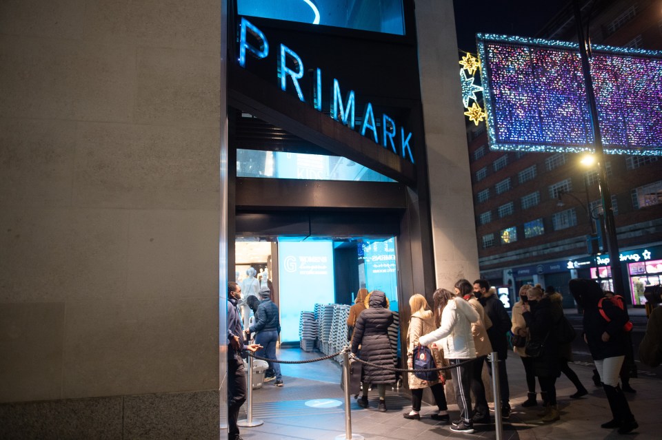 Shoppers queued outside Primark on Oxford Street, London, waiting for it to reopen after lockdown