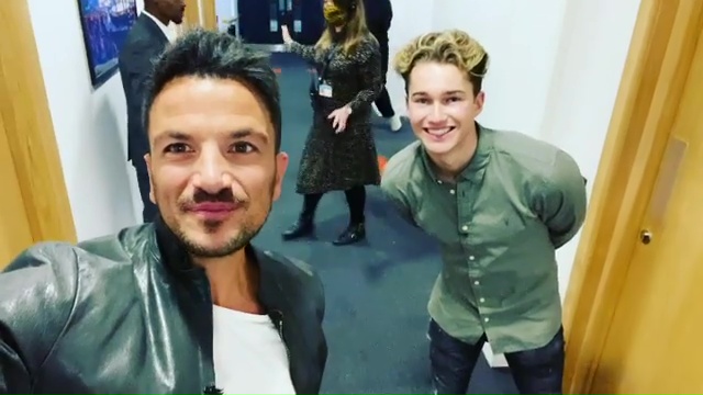 The singer was all smiles as he caught up with AJ Pritchard backstage 