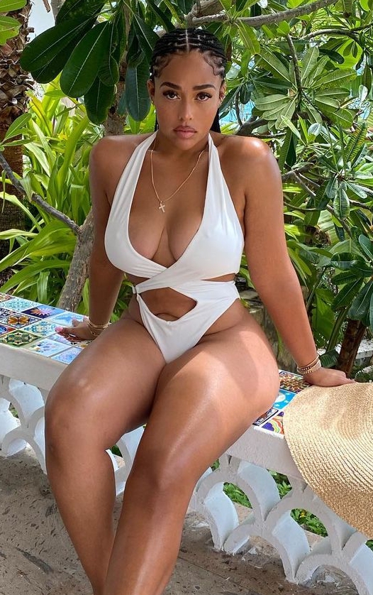 Jordyn Woods braved the white as she sat among the trees