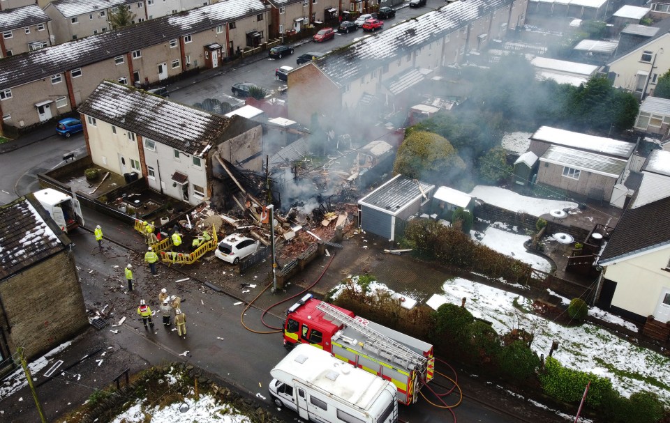 An aerial photograph shows the property turned to rubble