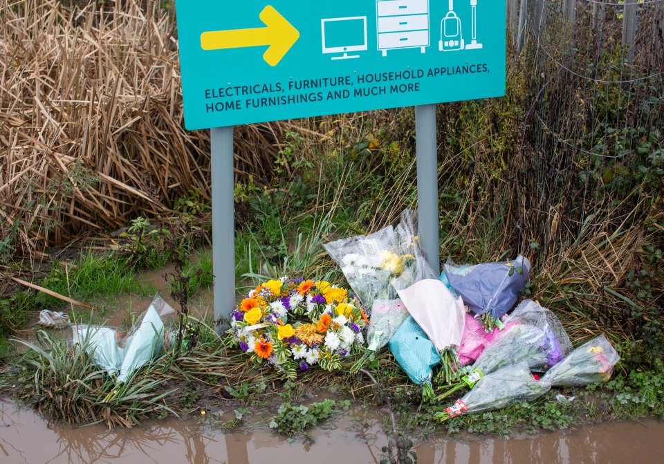 Flowers have been left at the scene in memory of the four lives lost