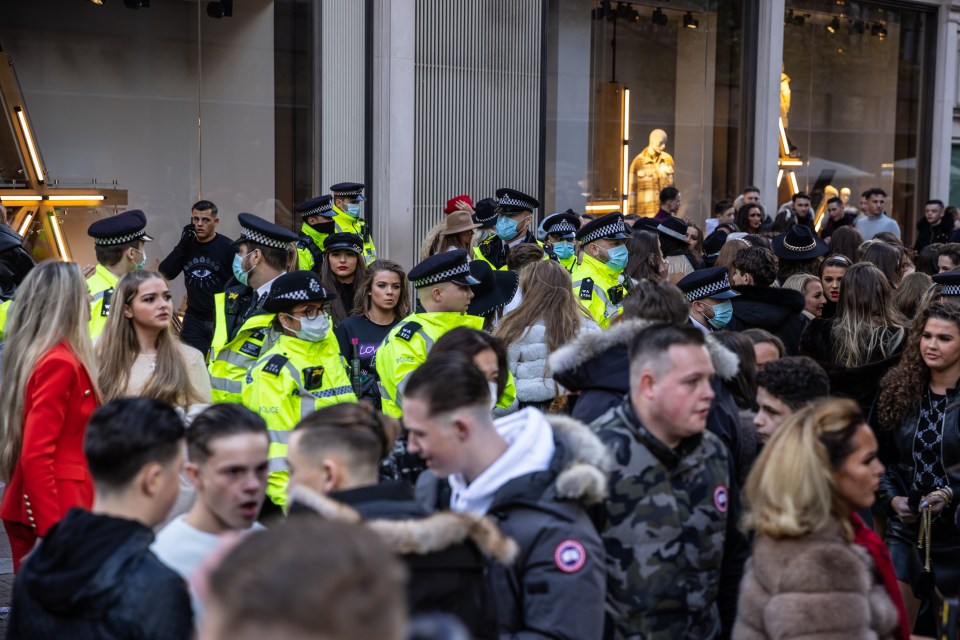 Cops formed a protective ring around the posh store