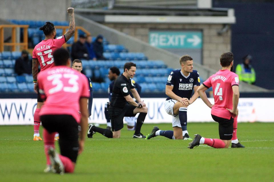 Millwall condemned the fans who booed their players taking a knee before kick-off against Derby