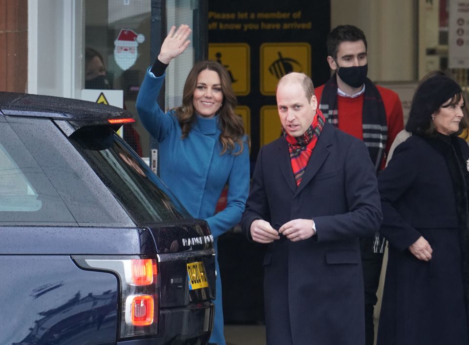 Kate Middleton smiles and waves as she arrives at the couple's second stop for the day