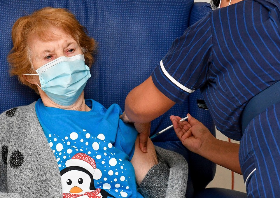 90 year old Margaret Keenan was the first patient in the UK to receive the Pfizer/BioNTech Covid-19 vaccine, administered by nurse May Parsons at University Hospital, Coventry, England, Tuesday December 8