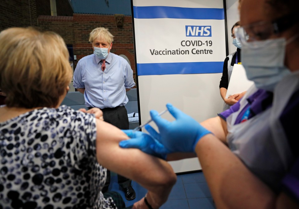 British Prime Minister Boris Johnson said Covid-19 vaccination is "safe, it’s the right thing to do, it’s good for you and it’s good for the whole country". He is pictured watching Lyn Wheeler receive her jab at Guy's Hospital in London this morning 