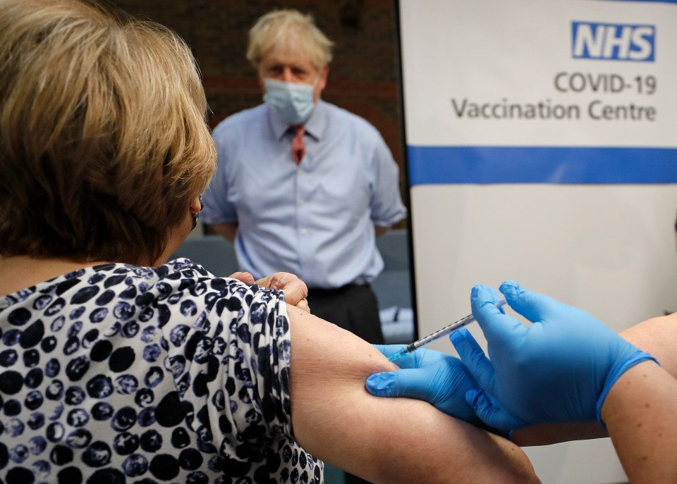 Boris Johnson watches as Lyn Wheeler gets the jab at Guy's Hospital in London