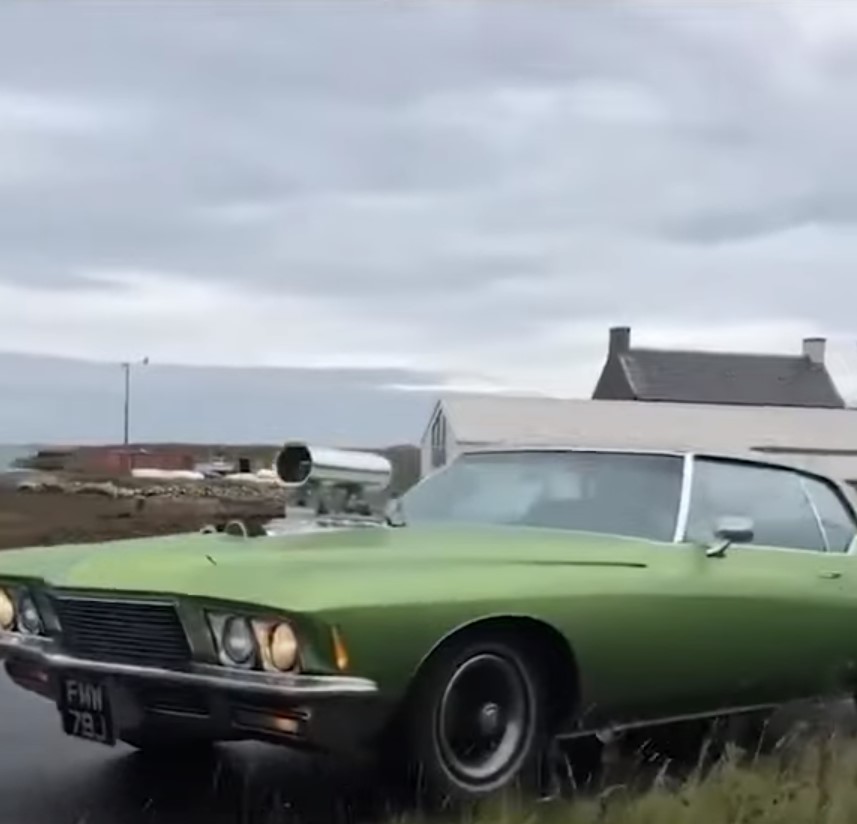 Richard Hammond follows close behind in a green motor