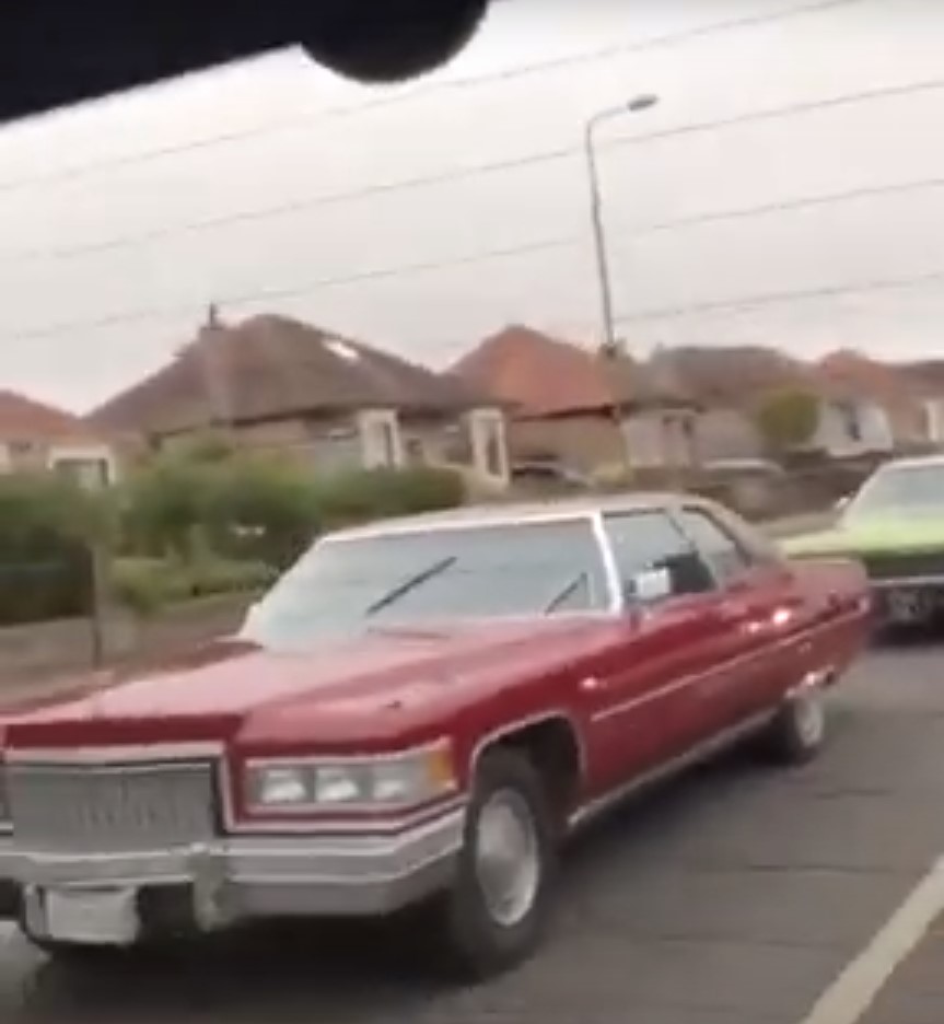 They arrive in Edinburgh driving three large American cars