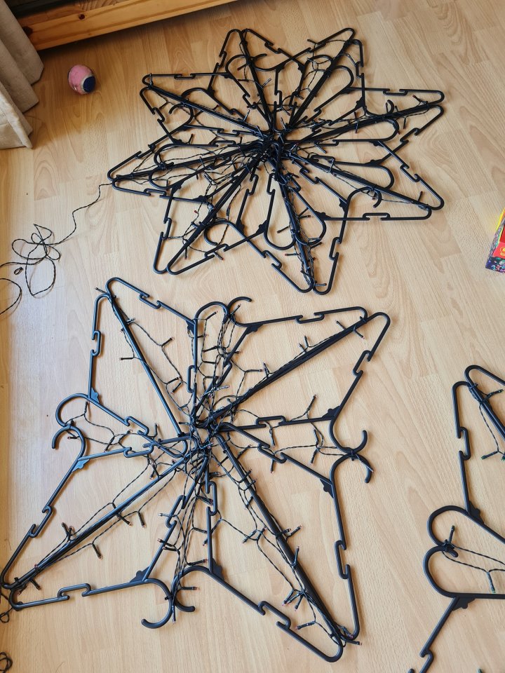 If your wardrobe is overflowing - grab some coat hangers to make a festive star 