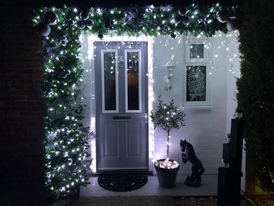 She used old decorations and Christmas tree branches to create a stunning porch 