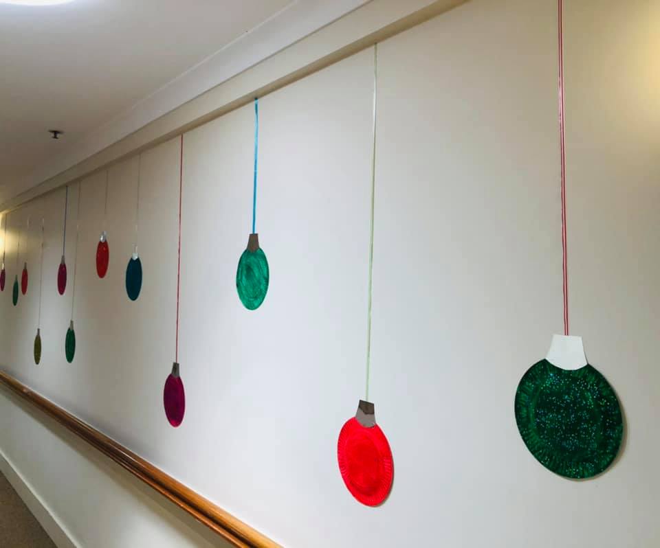 If your hallway is looking a little bland, dig out some old paper plates and turn them into giant baubles 