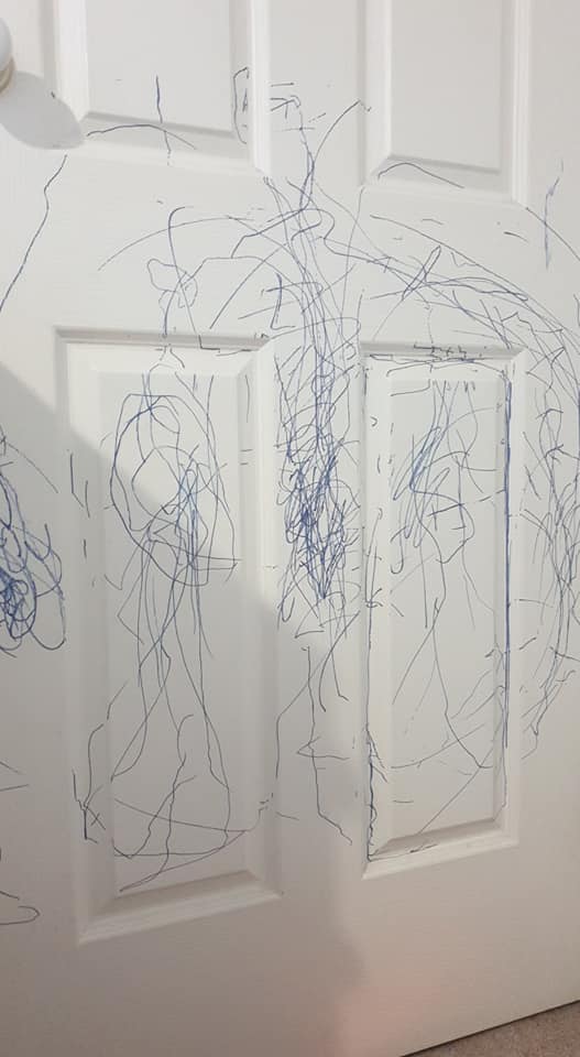 Mum shocked after her toddler son scribbled all over her white door 