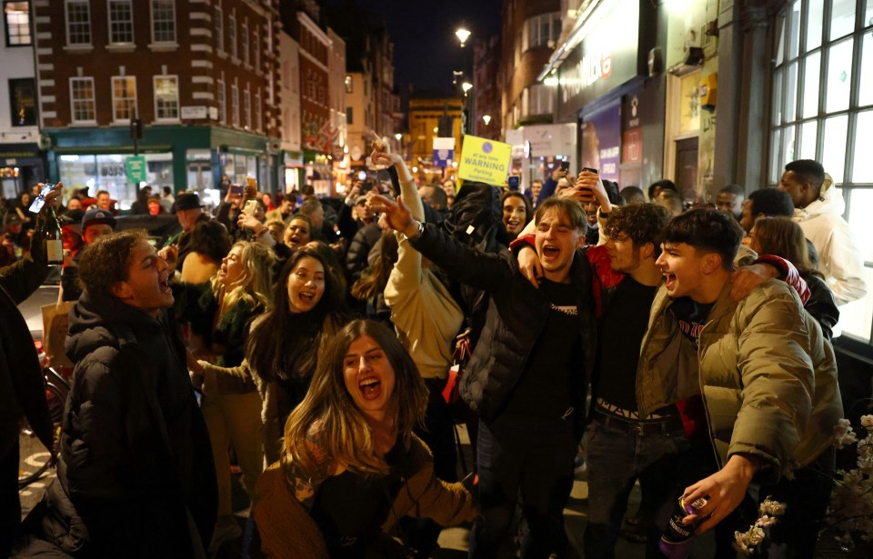 Drinkers partied in the street in Soho, central London, after last orders