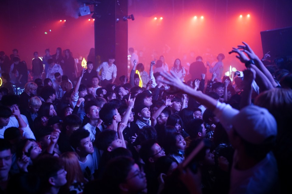 Pandemic what pandemic? Clubbers pack out a venue in Wuhan where Covid crisis began