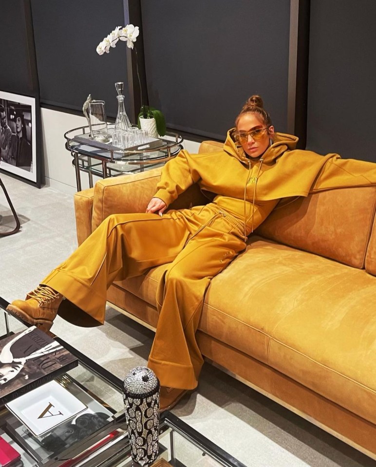 The singer donned a sweatsuit from pal Beyonce’s new Ivy Park collection as she lounged around in luxury next to a jewelled J-Lo bottle