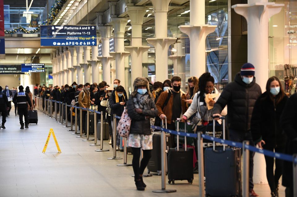 People at St Pancras station in London, waiting to board the last train to Paris 