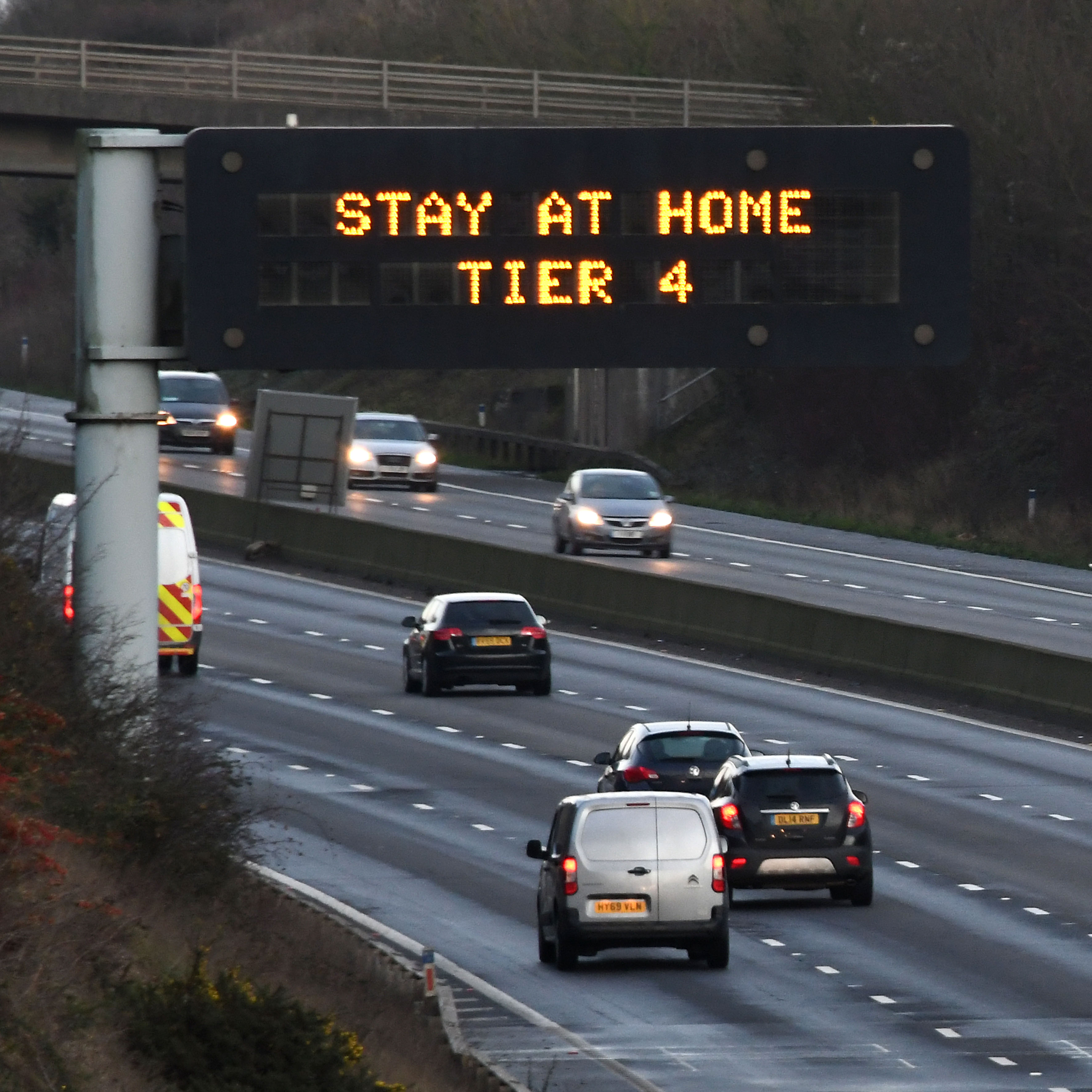 A sign on the M27 motorway near Portsmouth in Hampshire warning people in Tier 4 to stay at home