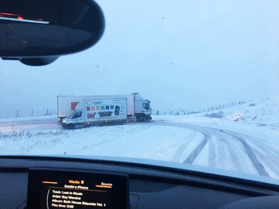 The icy roads caused a truck to skid