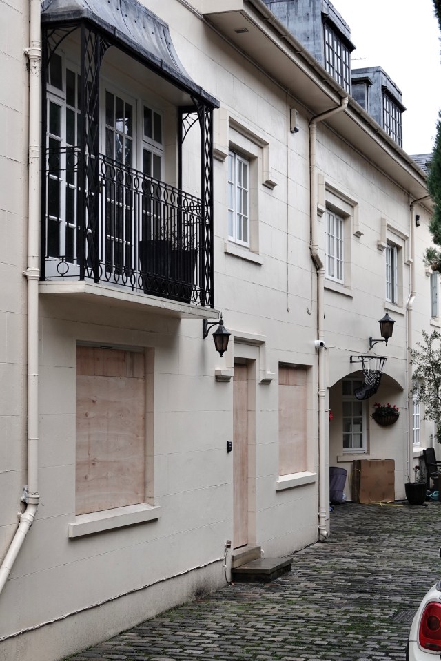 The windows of the house of George Michael are boarded up after the windows were broken by Fadi