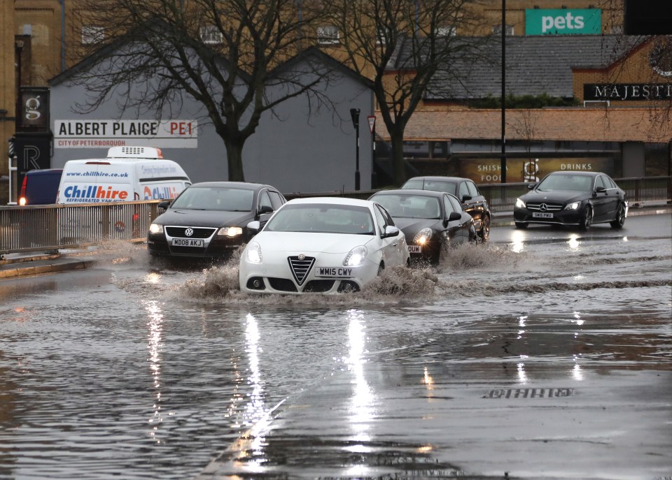 Shoppers in Peterborough, Cambridgeshire, battled flooding to finish off Christmas shopping