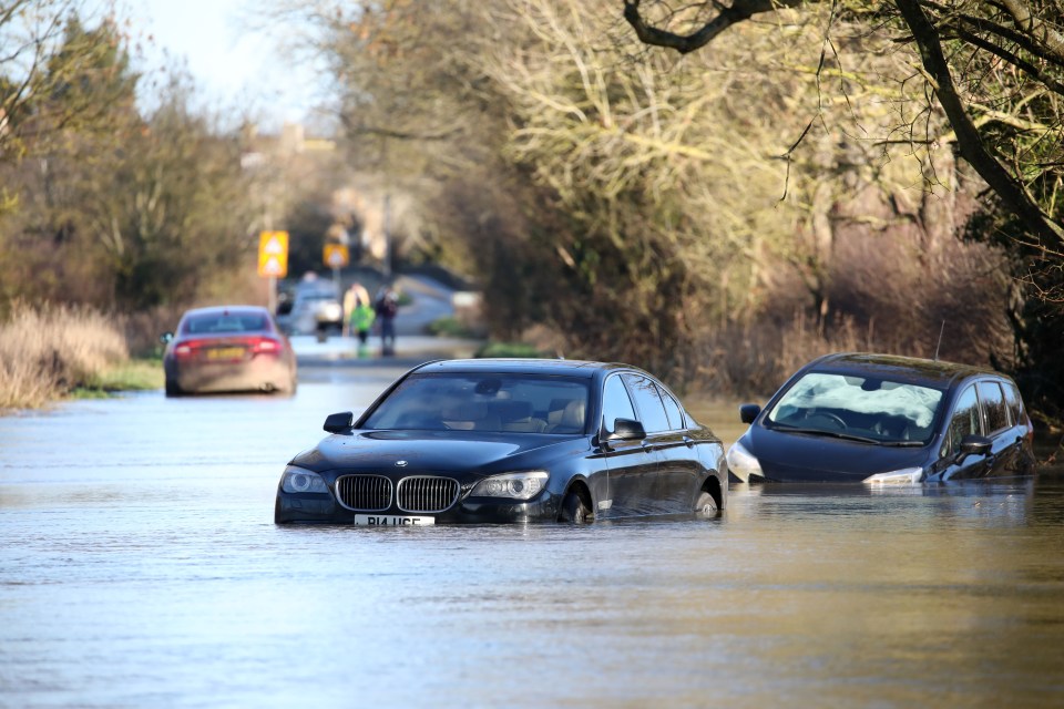 Drivers abandoned their cars after the River Nene near Peterborough burst its banks