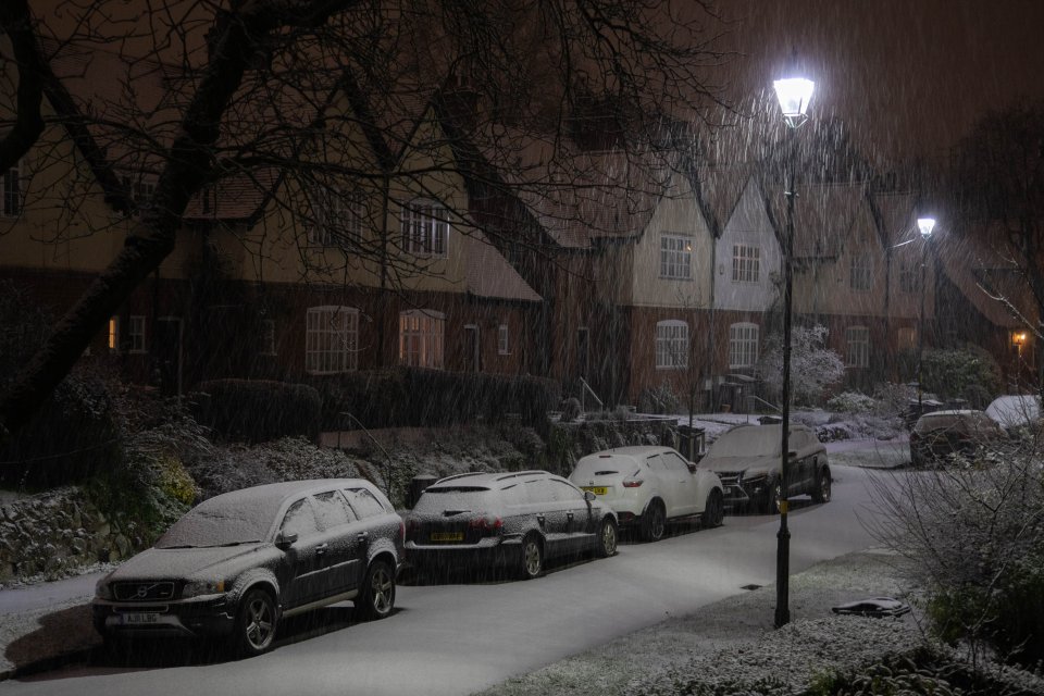 Cars were blanketed with snow in Birmingham