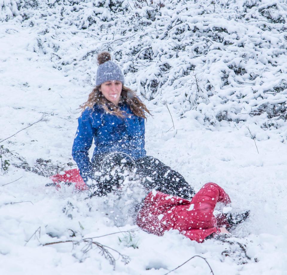 A woman and daughter play in the snow in Kidderminster