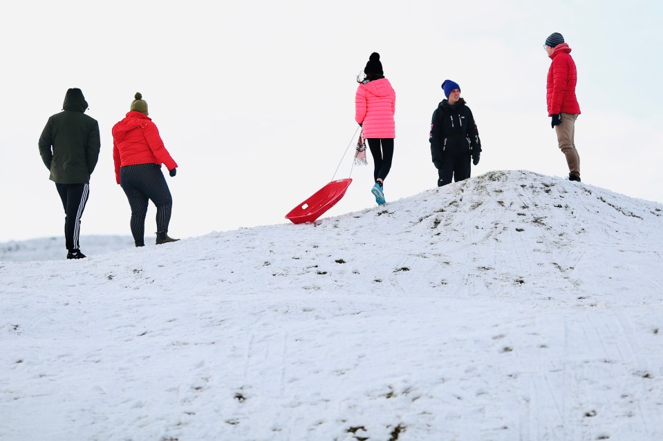 Thrill-seeking sleighriders take to the snow in the Brecon Beacons