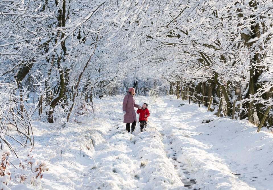 Harris Cameron and his mum Alison enjoy a walk through deep snow in West Lothian, Scotland, 