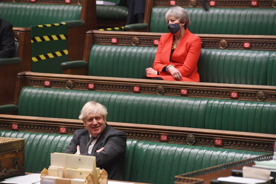 Theresa May sits behind Boris Johnson during the Brexit deal debate