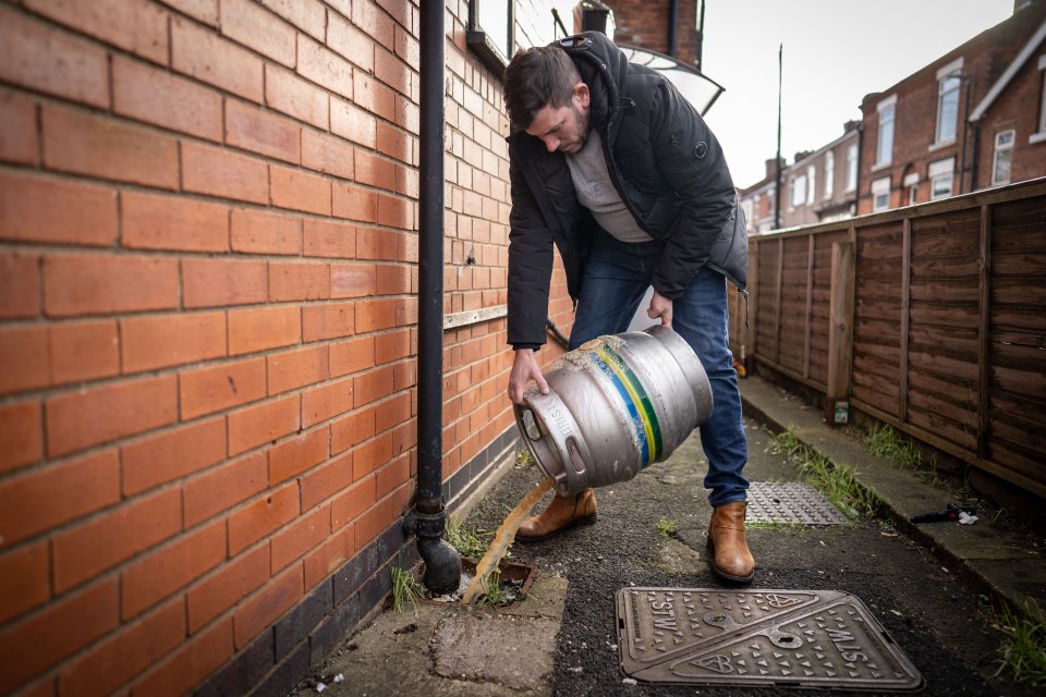 Publicans were forced to tip beer down the drain, like this pub owner in Ripley, Derbyshire