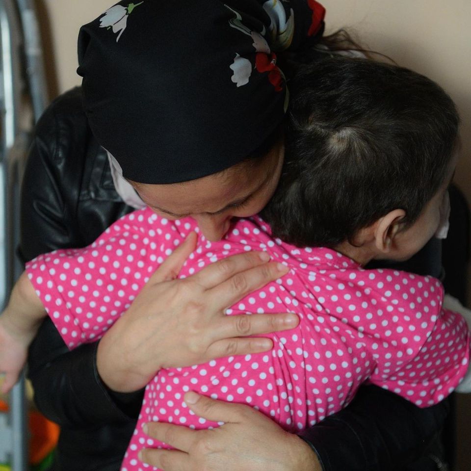 The girl's mum, Lidiya Yevloyeva, hugs her girl