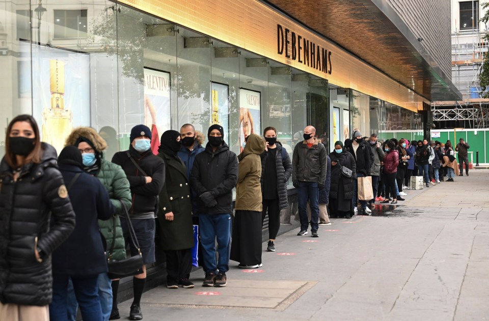 Keen shoppers were pictured outside Debenham's last night