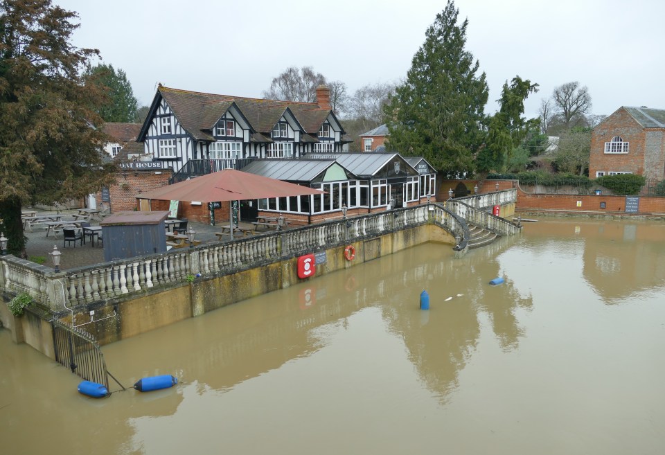 The River Thames bursts its banks causing flooding to the surrounding areas