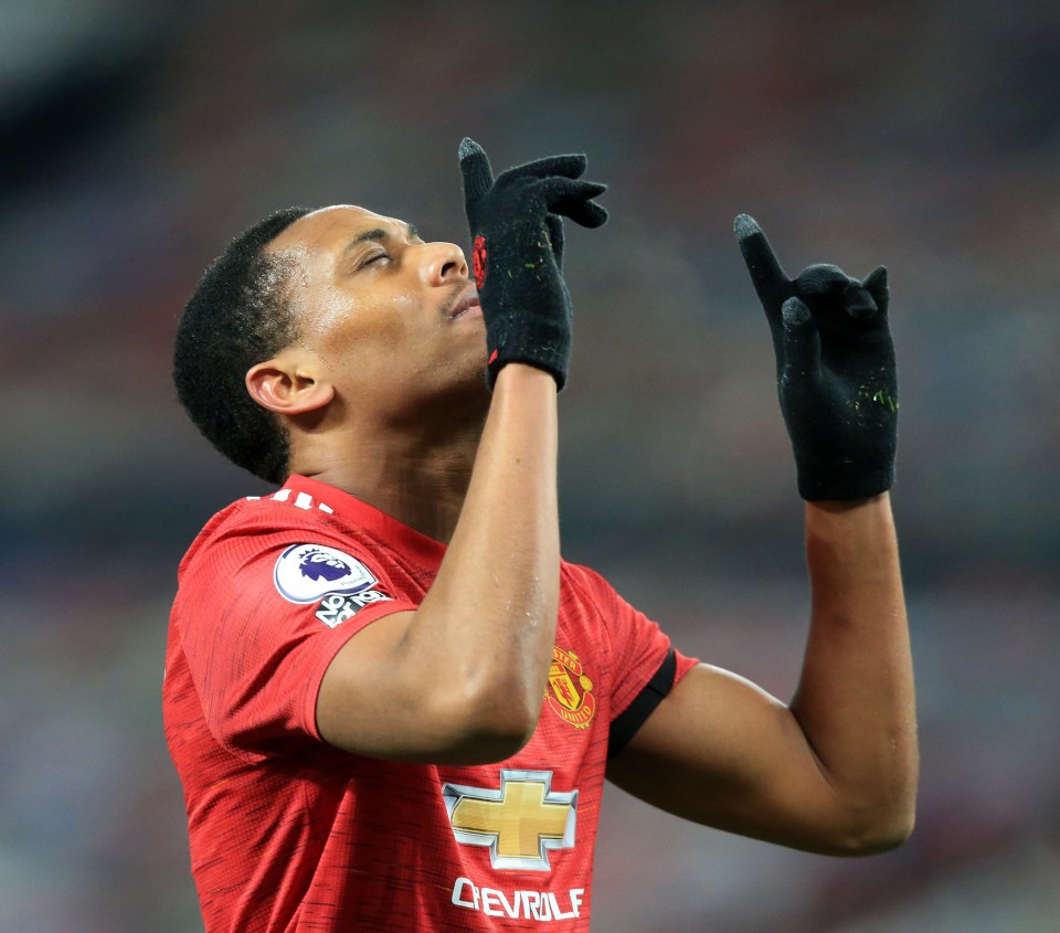 The Frenchman celebrates his first-half goal at Old Trafford