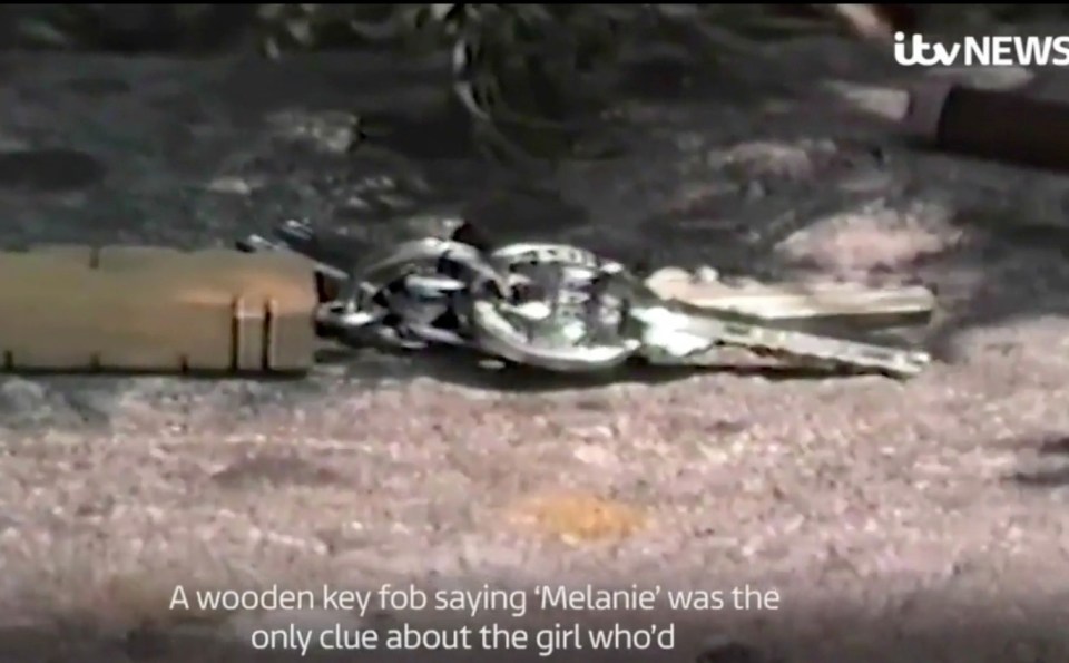 A keyring featuring Melanie's name was found on the wall above her body