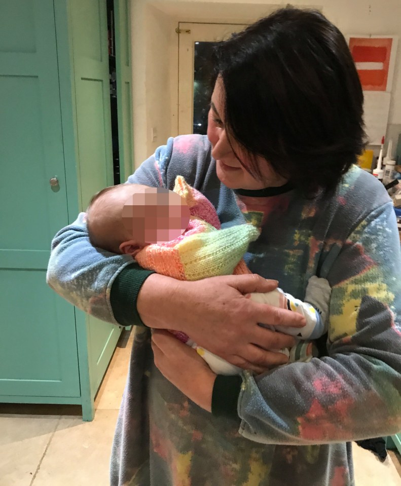 Louise, pictured recently with her baby step-granddaughter, noticed Eden had permanent red rings around her eyes