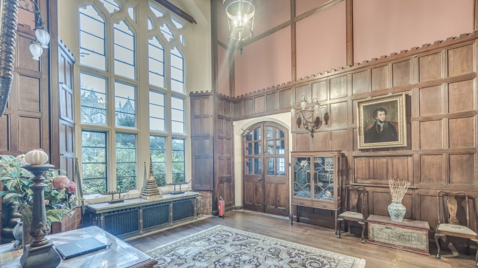 The home features decorative tiles, timber floors and wooden panelling