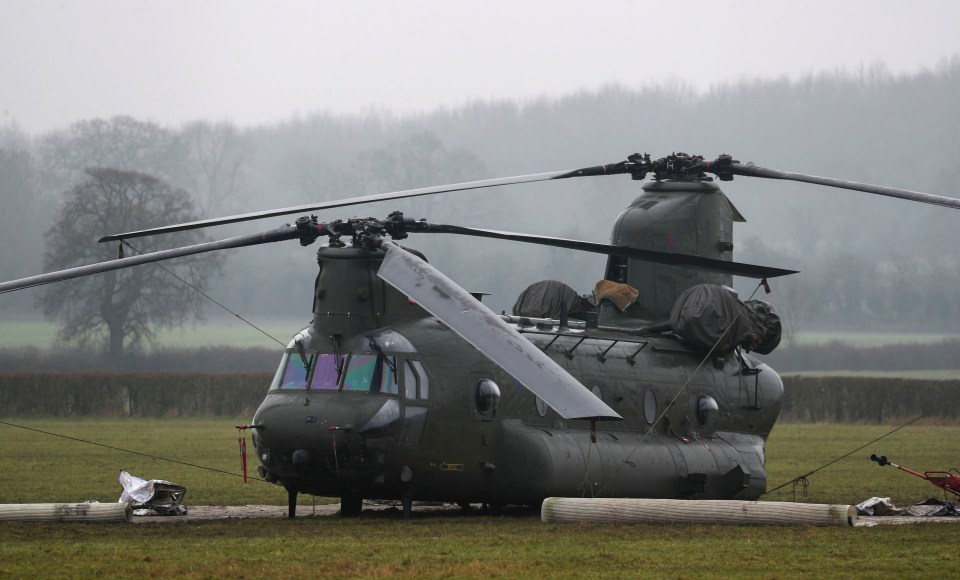 An RAF Chinook sits in a boggy field after an emergency landing