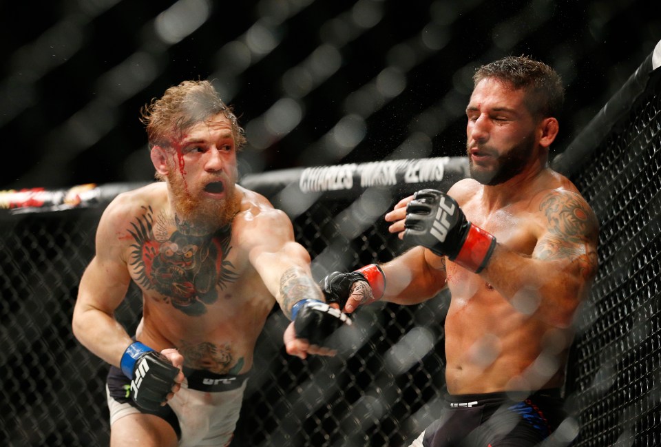 Chad Mendes gets struck with a left hook by McGregor at UFC 189 in 2015