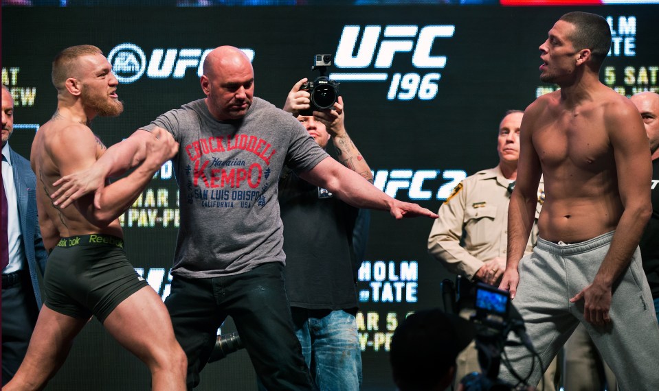 UFC president Dana White separates McGregor and Diaz at the weigh-in before UFC 196