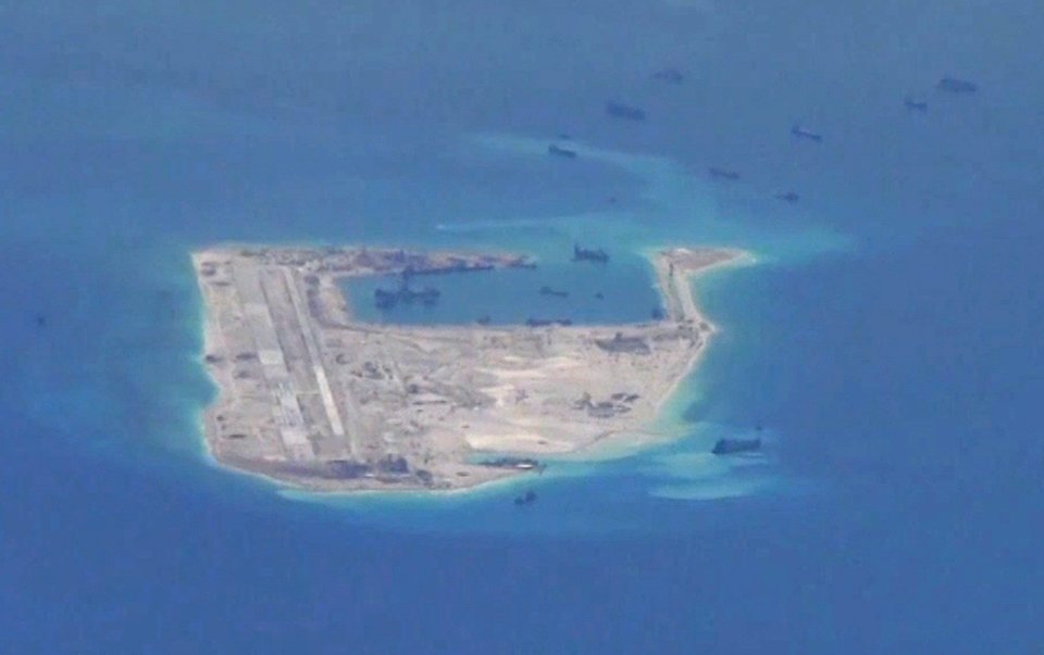 Chinese dredging vessels seen in waters around the disputed Spratly Islands in the South China Sea