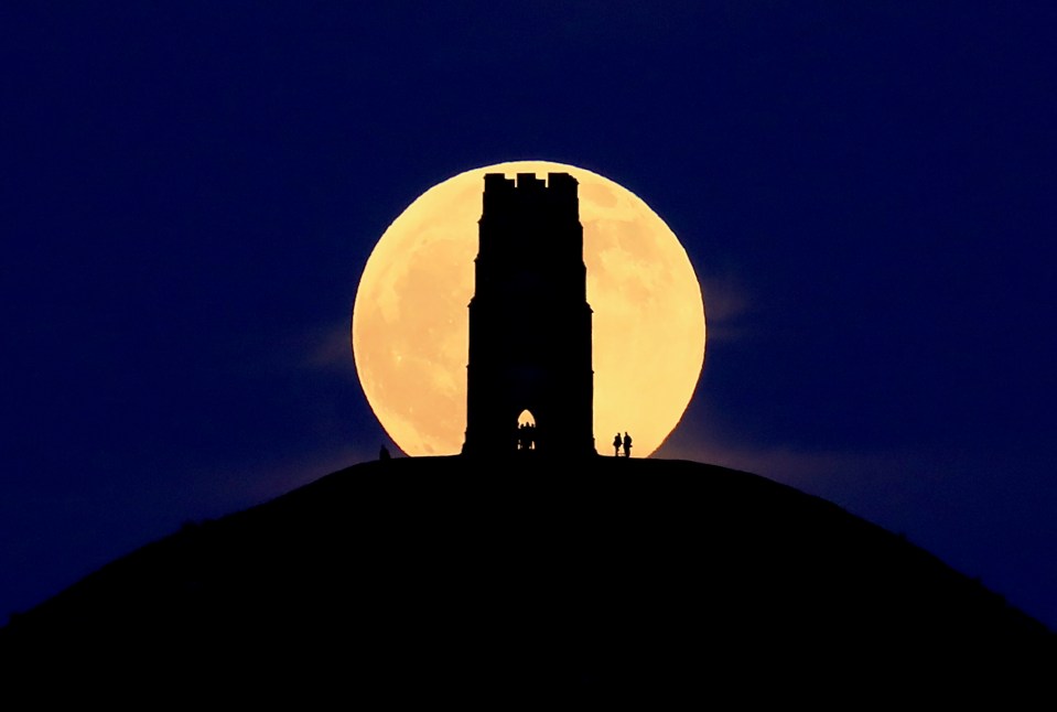 A Full Wolf Moon from a previous year rising over Glastonbury Tor