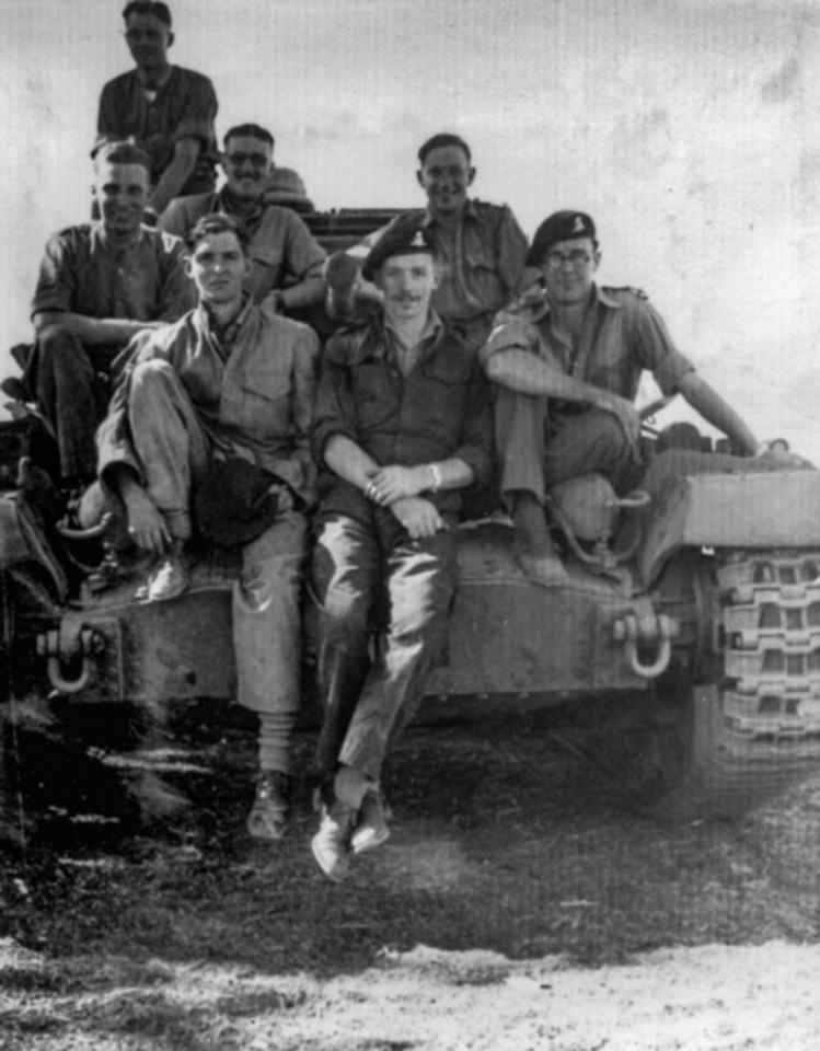 Captain Tom (centre) pictured during his time in the British army