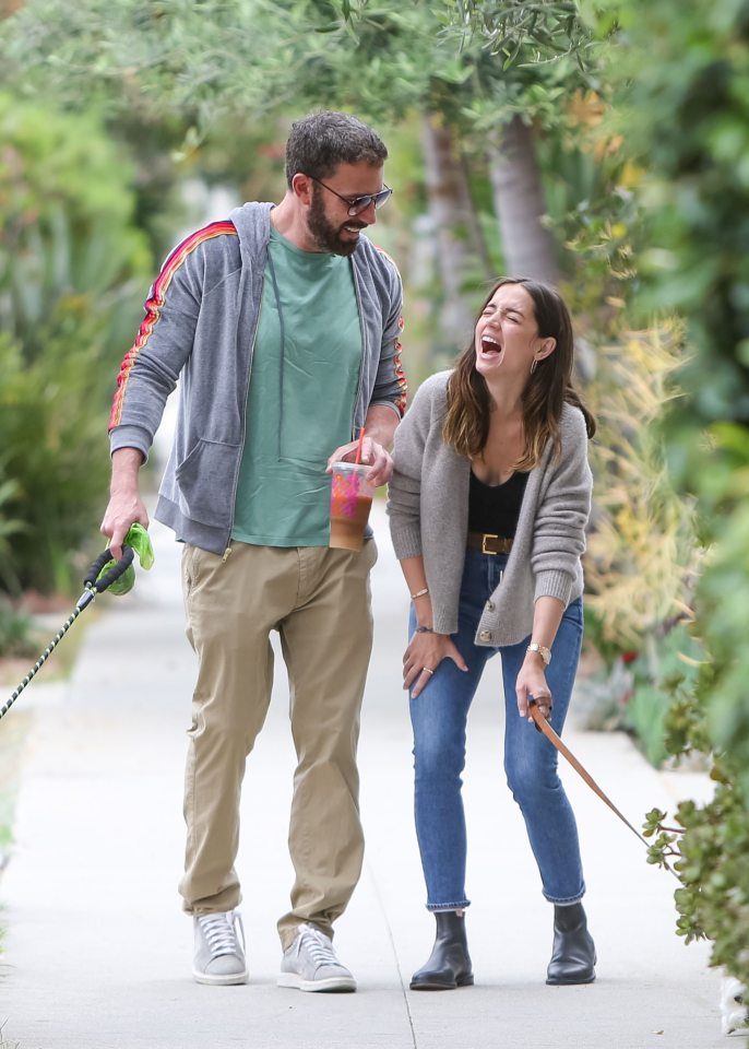 The loved-up couple shared laughs as they walked their dogs in Los Angeles