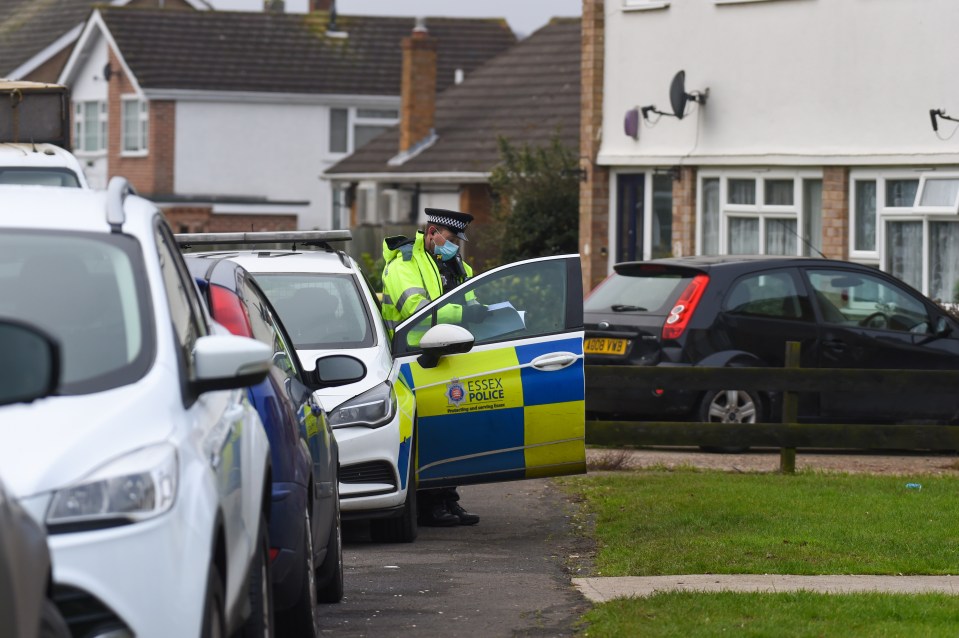 Police are seen outside the Rayleigh home after the tragedy